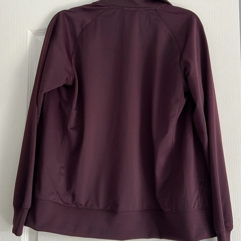 Maroon Nike Jacket size XL Youth black and orange detailing fits womens M/L
